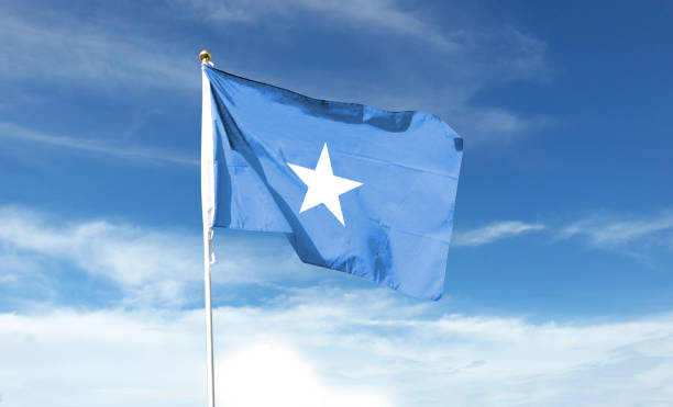 istock Somalia flag on cloudy sky. waving in the sky 1441393889