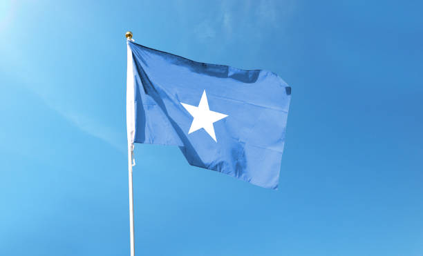istock Somalia flag on cloudy sky. waving in the sky 1441393962