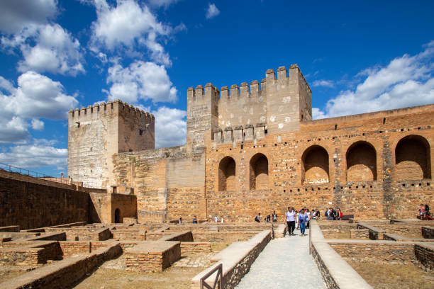 Granada, Spain - May 26, 2019: Group of tourists at the famous Alhambra Palace
