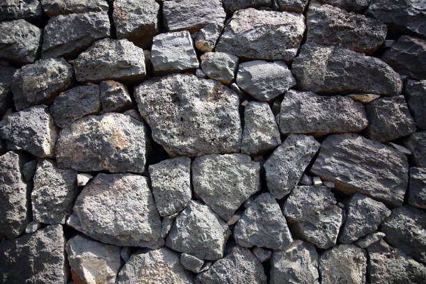 stone wall pattern Basalt stone wall pattern unique to Jeju Island old stone wall stock pictures, royalty-free photos & images