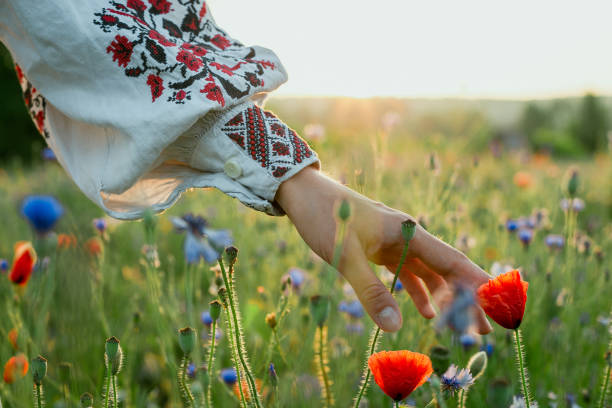 istock Close up lady caressing poppy concept photo 1441394277