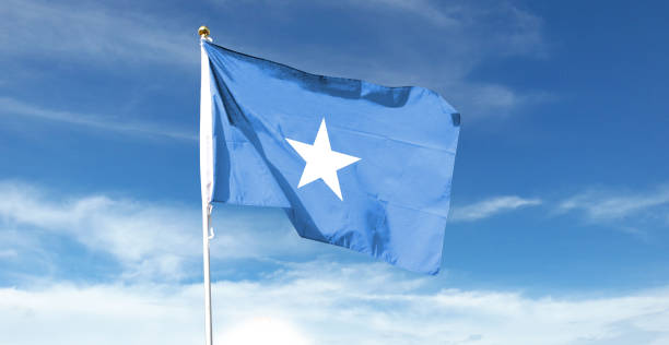 istock Somalia flag on cloudy sky. waving in the sky 1441394553