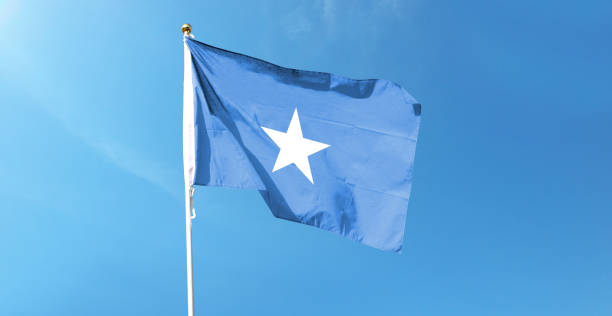 istock Somalia flag on cloudy sky. waving in the sky 1441395523