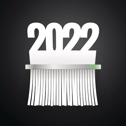 Document 2022 is cut into shredder on dark background. Clipping paths included.