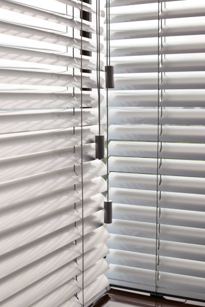 istock Aluminum blinds closeup on the window 1441397087
