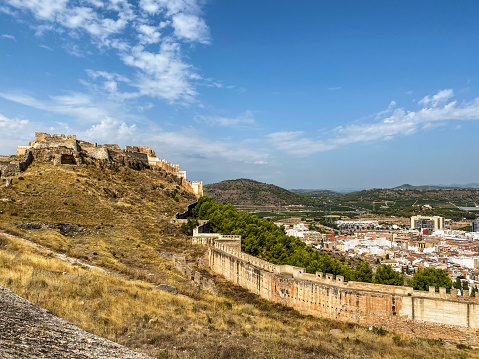 View from afar of the castle ruins and town of Sagunto in the Valencian Community, Spain