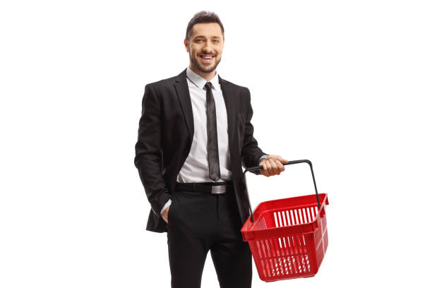 istock Young man in a suit standing with an empty shopping basket 1441397946