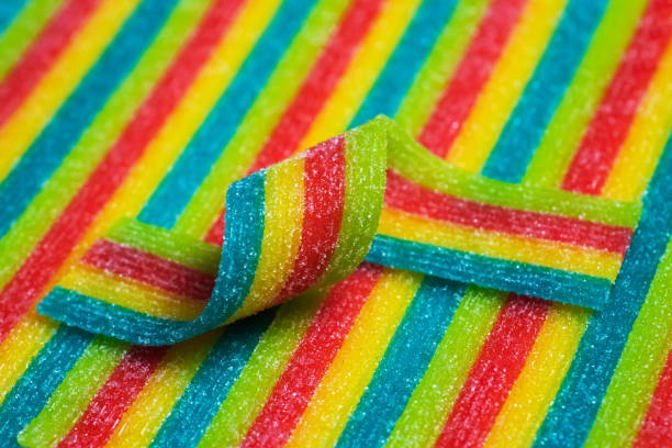 istock Rainbow sour jelly candies strips in sugar sprinkle. 1441398034