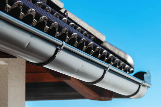 istock House roof rain gutter on sunny day 1441398312