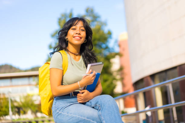 istock Asian girl on campus, student enjoying classes, smiling at university 1441399236