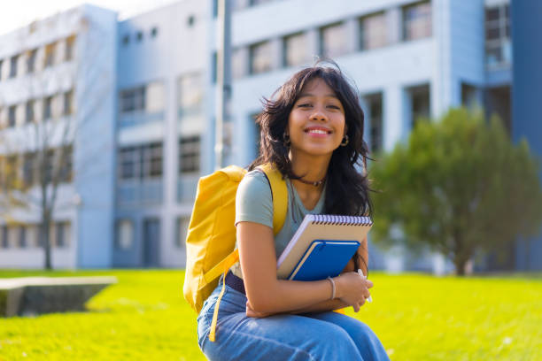 istock Asian girl on campus, student enjoying classes, smiling at university, sitting 1441399984