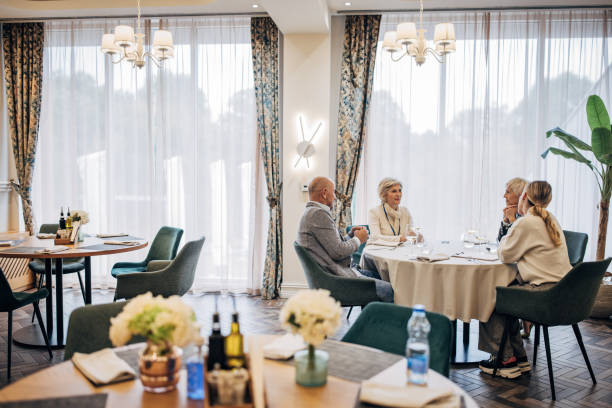 istock Business people in restaurant 1441400023