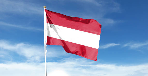 istock Austrian flag on cloudy sky. waving in the sky 1441401421