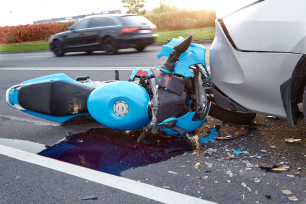 Damaged in a car accident motorbike October 6, 2021, Riga, Latvia, damaged car and motorbike on the city road at the scene of an accident because of non-observance of distance misfortune stock pictures, royalty-free photos & images