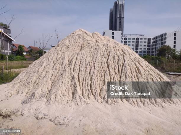 Sand Pile On A Construction Site In The City Washed By Raindrops Stock Photo - Download Image Now