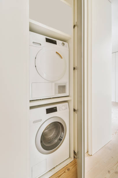 istock A small laundry corner with a washing machine and dryer 1441406023