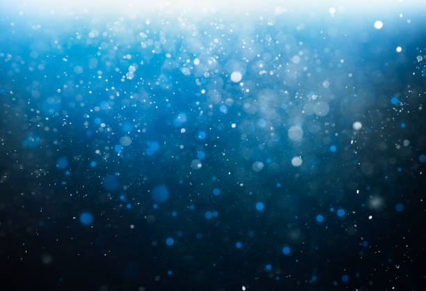 istock abstract dark blue background with white and blue out-of-focus lights 1441407838