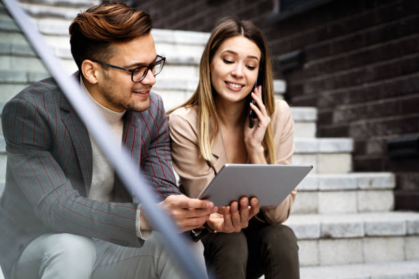istock Successful business colleagues people working together on digital devices. 1441410751