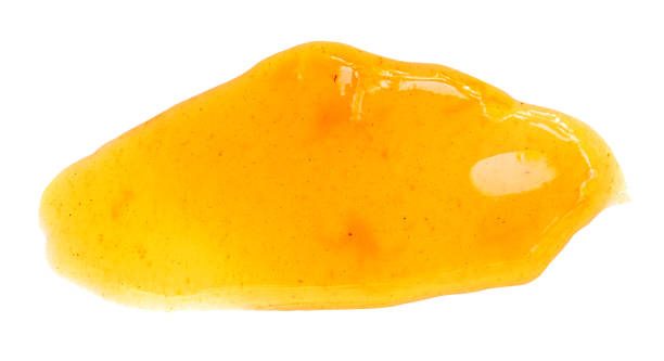 istock Apricot  jam isolated on white background, top view. Orange fruit or mandarine spread  Flat lay 1441412688