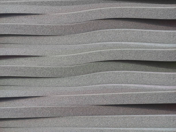a pile of thin gray sponge foam