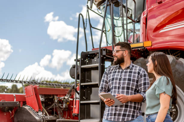 istock Agronomist and farmer using digital tablet in wheat plantation 1441414179