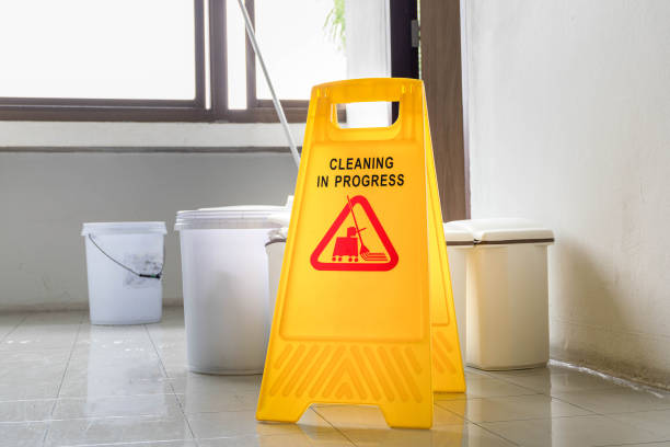 istock Close up yellow warning sign with message Cleaning in progress 1441414391