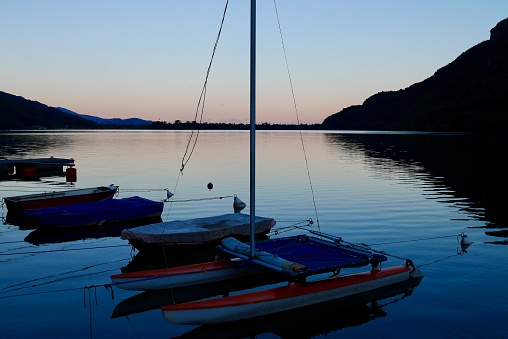 Boats on lake Mergozzo at sunset. Piedmont, Italy.