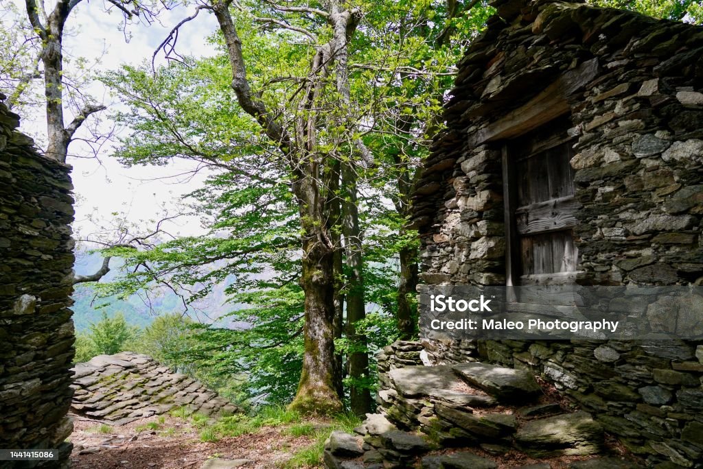 Rustici, traditional stone houses in the mountains at lake Maggiore. Piedmont, Italy. Absence Stock Photo