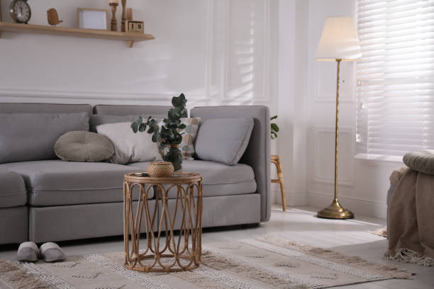 istock Living room with comfortable grey sofa and stylish interior elements near window 1441416087