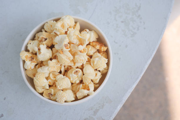 istock popcorn in a bowl on wooden desk 1441416177