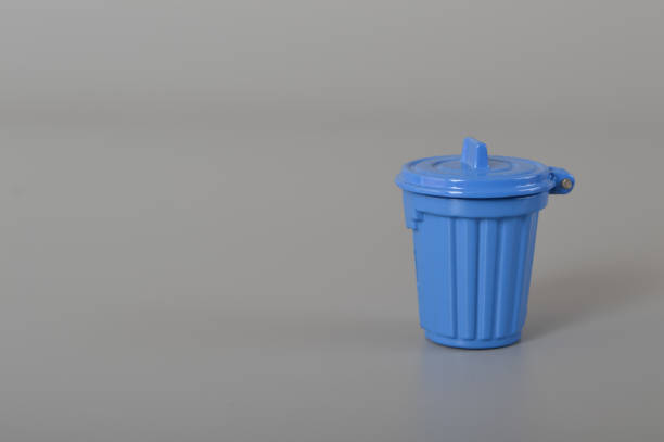 istock Blue trash can isolated on a grey background. Copy space for the text. 1441416287