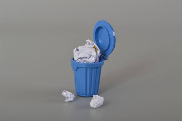 istock Tracy can with full of garbage isolated on a grey background. Cody space for the text. 1441416495