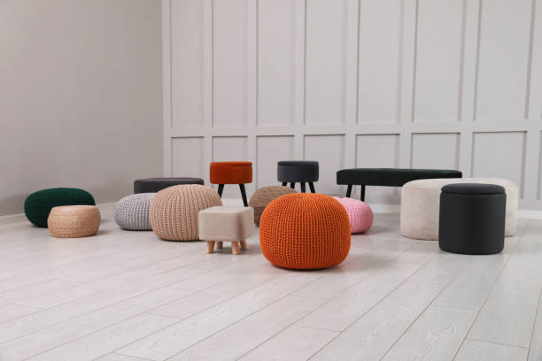 istock Different stylish poufs and ottomans in room 1441418294