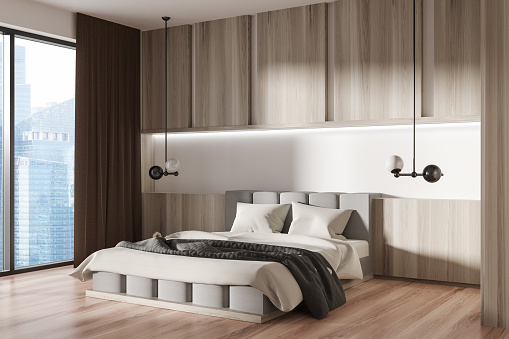 Wooden bedroom interior with bed and lamps, side view, hardwood floor. Hotel sleeping area with panoramic window on Singapore city view. 3D rendering