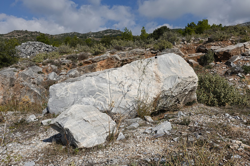 Marble rocks close to an old quarry. Penteli mountain, Athens Greece.