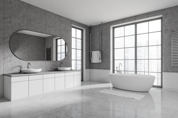 istock Light bathroom interior with tub and double sink with mirror, panoramic window 1441419678