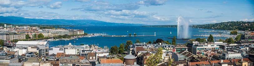 View from Lake Leman of residential areas of Swiss city of Lausanne in cloudy summer day,  canton of Vaud in Romandy