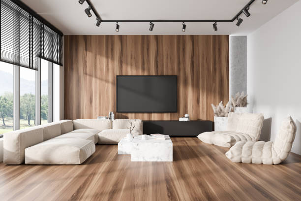 istock Stylish chill interior with couch, decoration and tv screen, panoramic window 1441420670