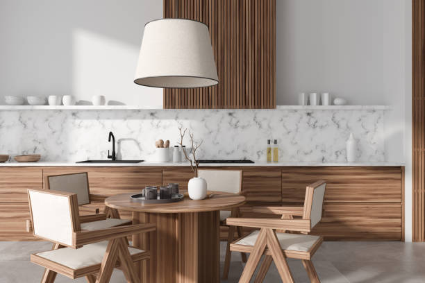 istock Stylish kitchen interior with eating table and kitchenware in cooking zone 1441421811