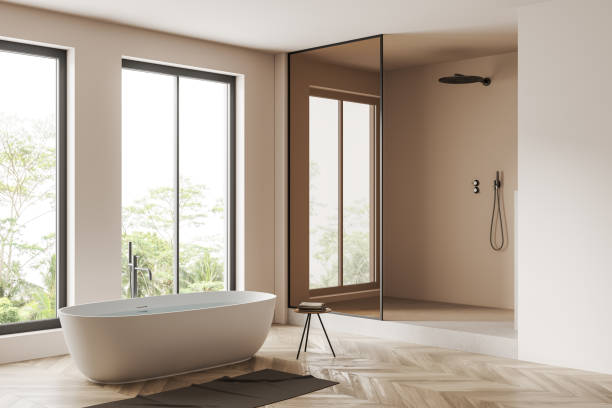istock Corner view on bright bathroom interior with bathtub, panoramic windows 1441421855