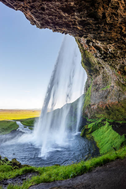 istock Walking behind Seljalandsfoss waterfall in summer, Iceland 1441422143