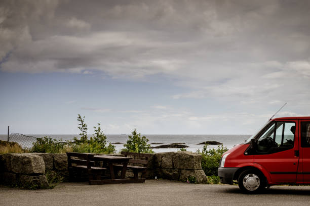 istock Camper car on coast of Norway with ocean view 1441424076