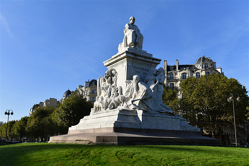 Paris, France-10 07 2022: Monument by the sculptor A.Falguière, created between 1900-03, located in the center of the Place de Breteuil in Paris, and erected in memory of the scientist Louis Pasteur (1822-1895), the discoverer of the rabies vaccin in 1885. France.