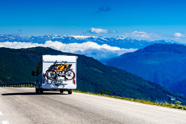 istock Camper car with bicycles on road 1441426446