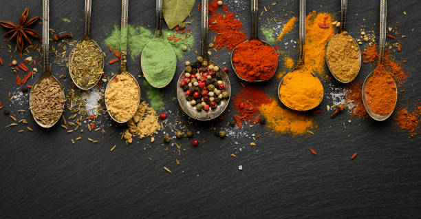 istock Various seasonings and spices on black stone plate 1441427678