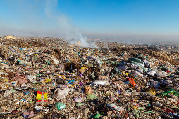 istock Burning trash piles in landfill 1441427780