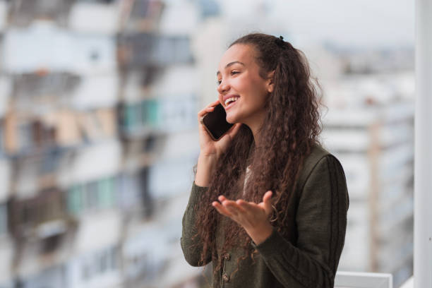 istock Young woman explaining business during a phone call 1441430480