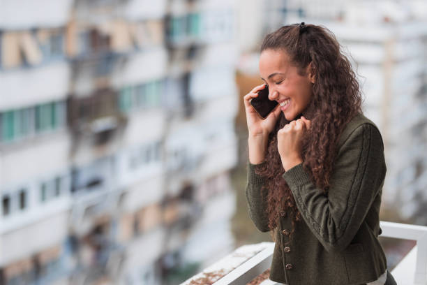 istock Happy woman excited about a phone call 1441430486