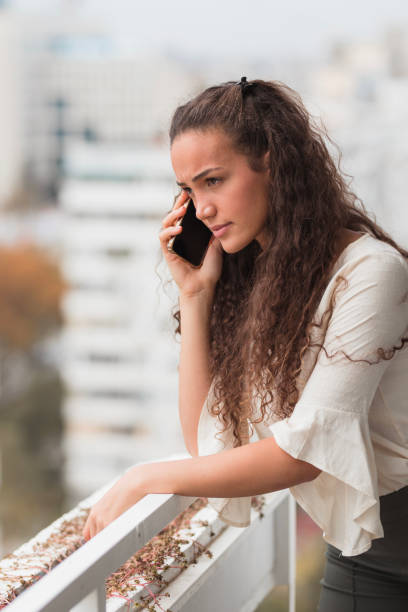 istock Serious business woman having phone conversation 1441430603