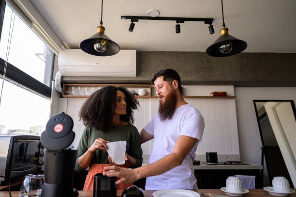 istock Couple preparing coffee and sandwiches together 1441432564
